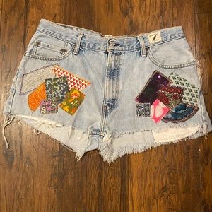 Upcycled Levi’s cutoff jean shorts with added patchwork design.